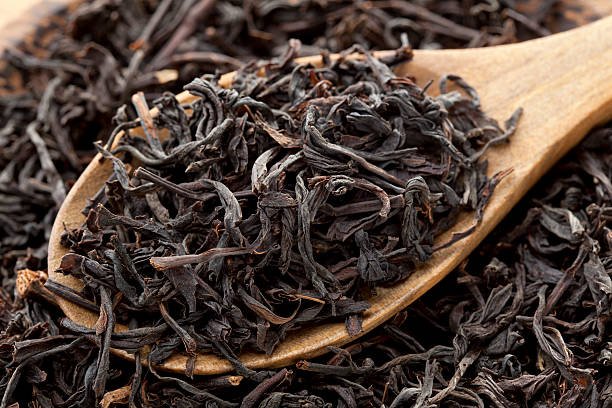 Black tea photographed in wooden spoon Black tea photographed in wooden spoon