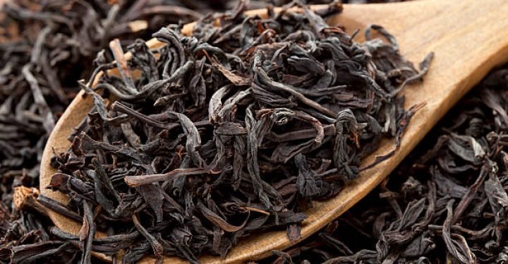 Black tea photographed in wooden spoon Black tea photographed in wooden spoon